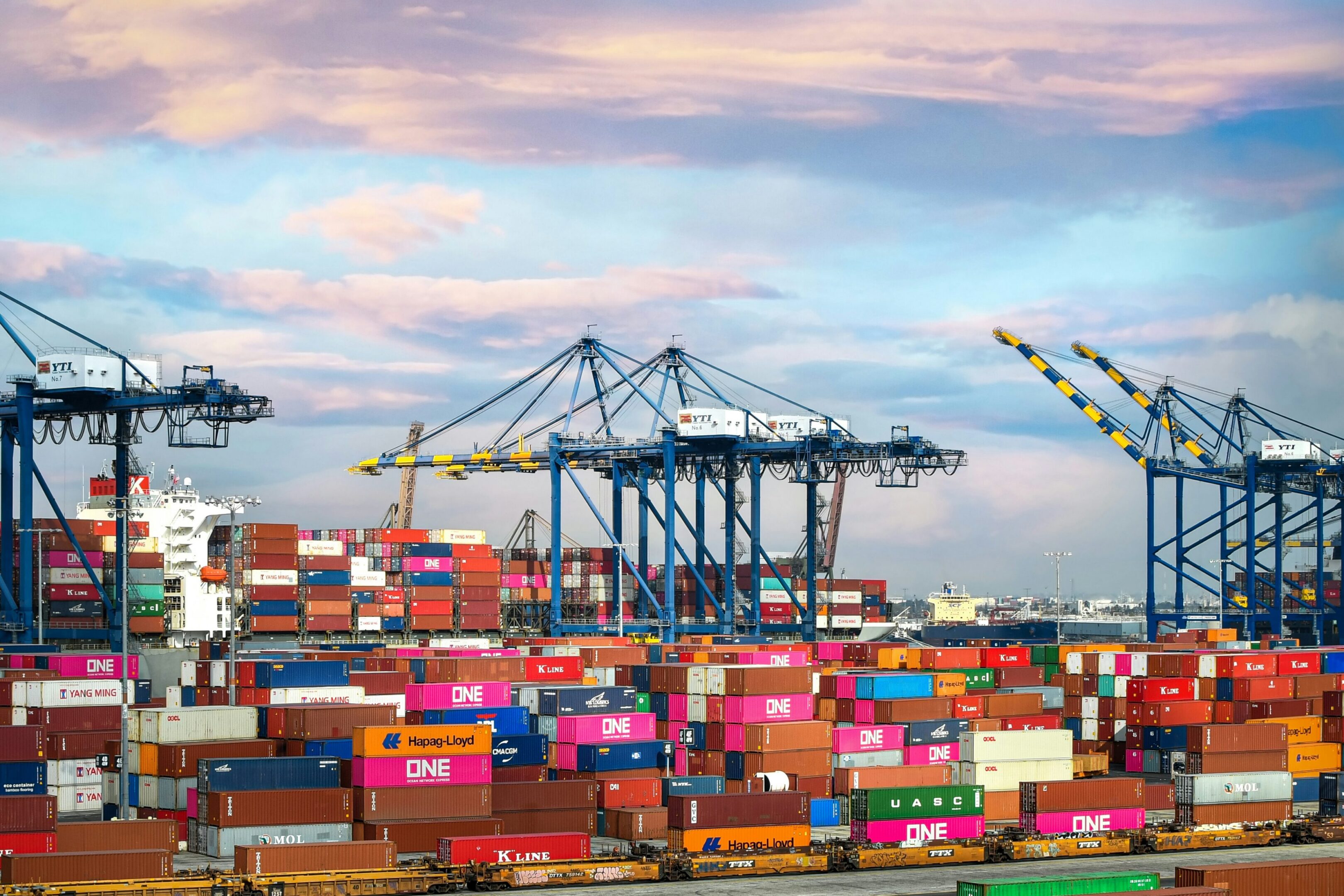 Colorful shipping containers and cranes