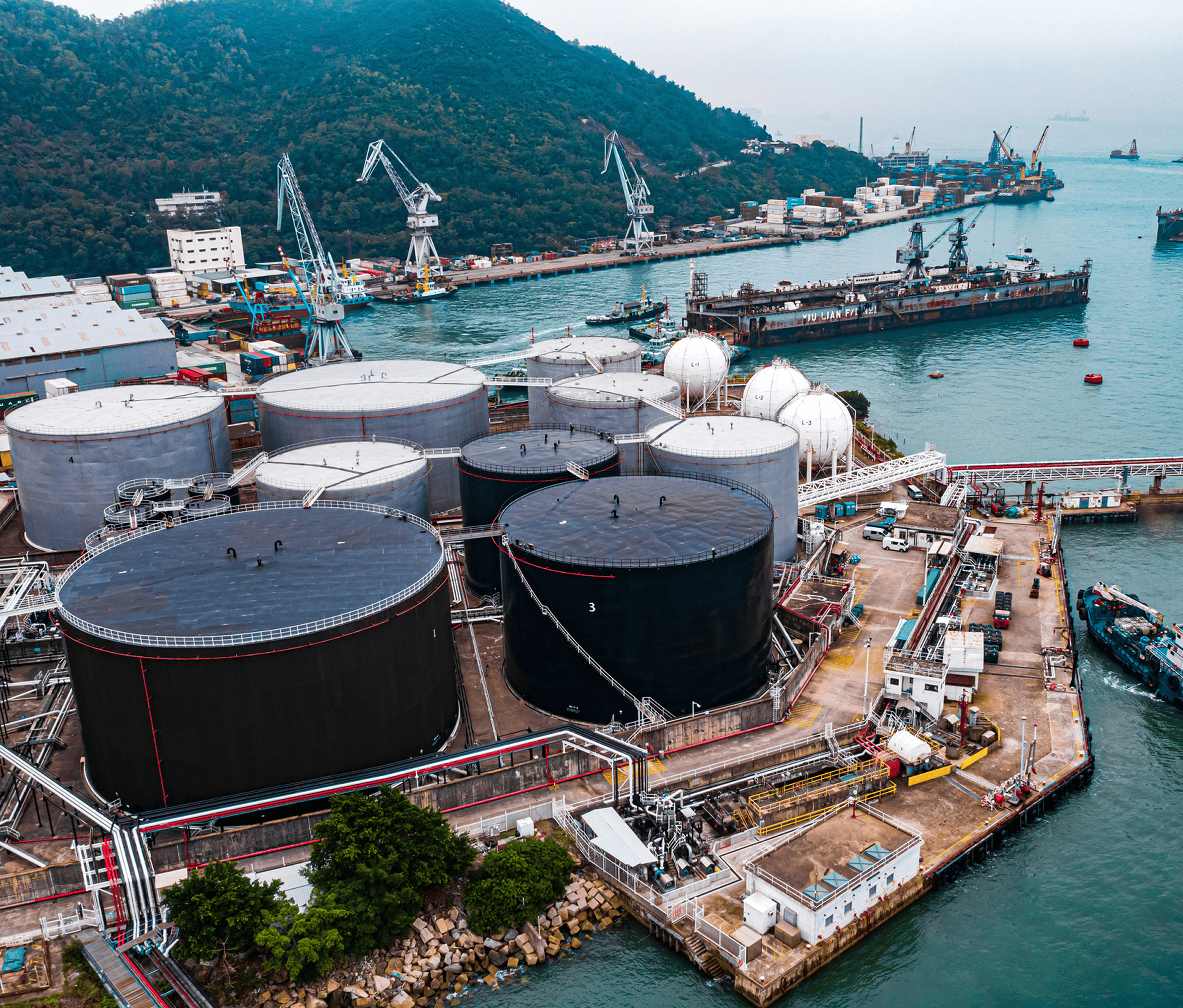 Oil storage tanks at coastal industrial port